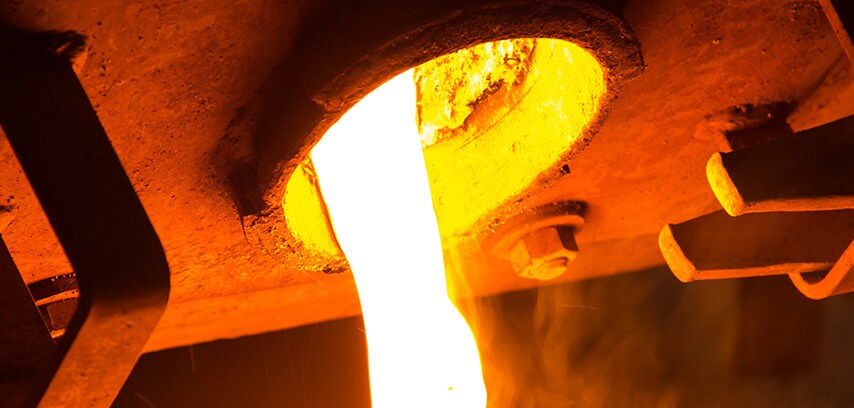 Molten metal pouring from refining opening