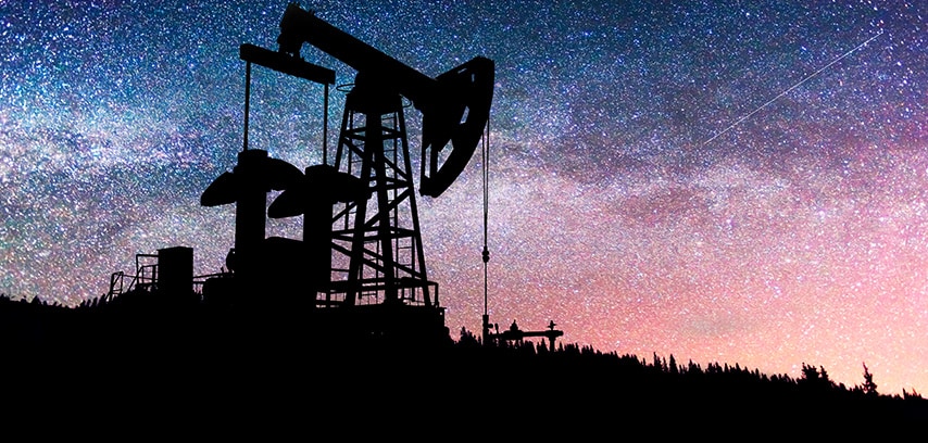 Oil rig at night with starry sky background