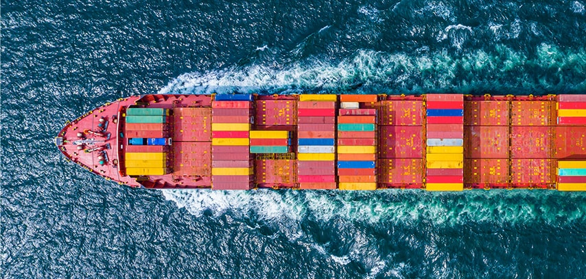 Cargo ship cutting through ocean